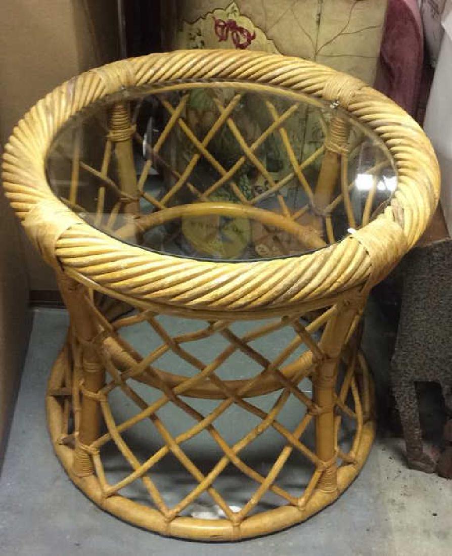 Poss Bamboo Round Glass Top Table: Circular Drum Style Open Weave sided Table ,appears to be bamboo. Contains glass top. Table is tan toned. Indoor or Outdoor table, outdoor furniture, patio furniture, patio table. Measures approx 22 i