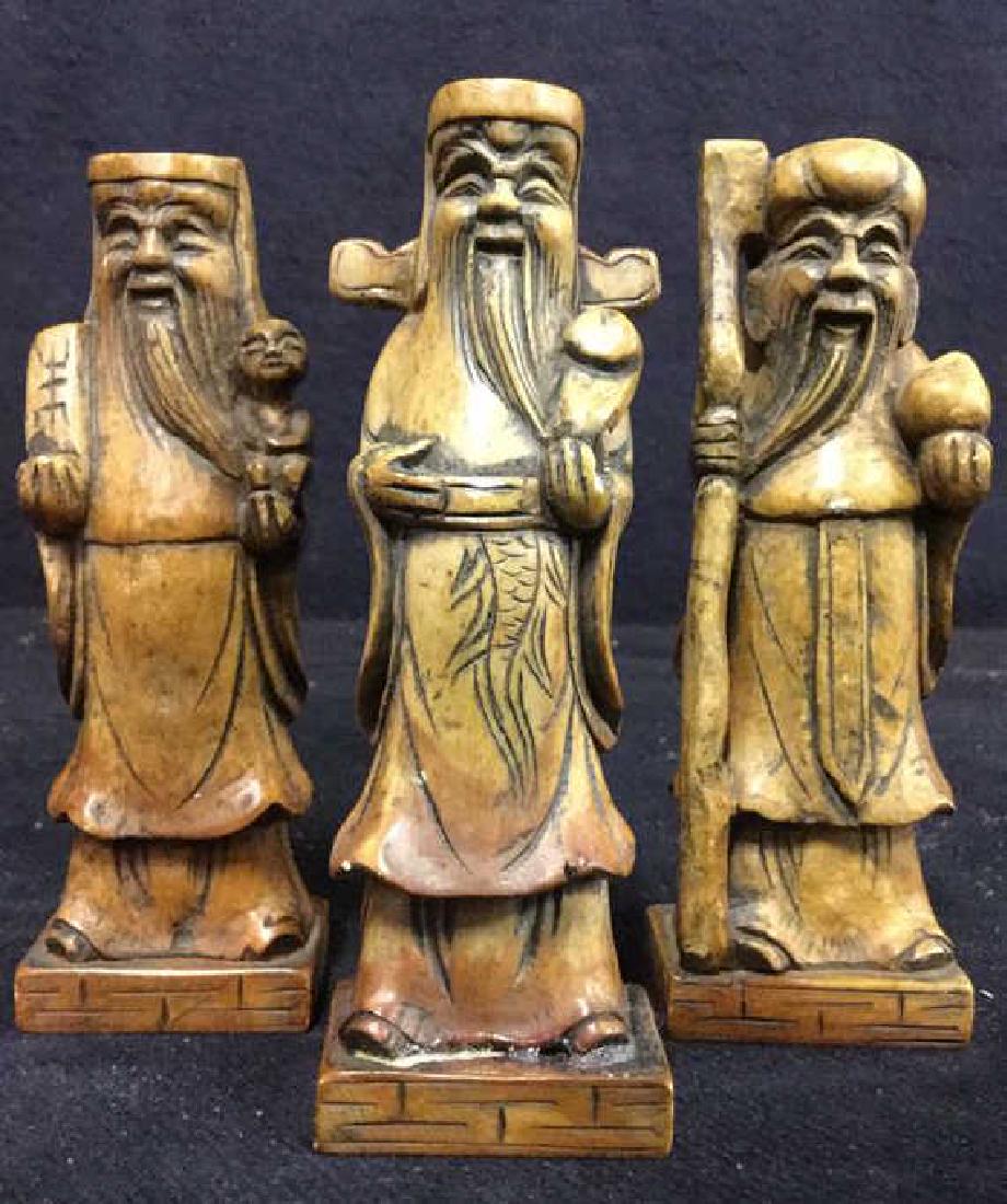 Lot 3 Alabaster Inuit Figurals: Includes 3 alabaster figurals. Measures approx 5 inches tall 1.5 inches wide. All pieces have very minor imperfections. Pieces are intricately carved. All pieces are light brown toned. 1 piece appears