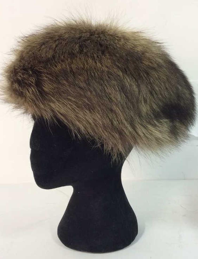 VINCENT & BILL NEW YORK Hat In Original Box: Tag on inside reads VINCENT & BILL NEW YORK. contains faux fur. Measures approx 11 inches long 4 inches tall. Comes in original box.