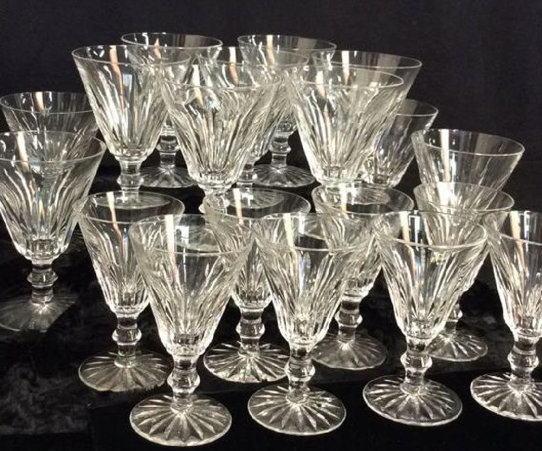 Set 19 WATERFORD Crystal Stemware: Set 19 WATERFORD Crystal Stemware. Cut crystal style. Marked on underside as WATERFORD. One piece has rim chip, some other minor surface wear and chips. 11 Wine goblets, 8 cordial glasses. Largest pie