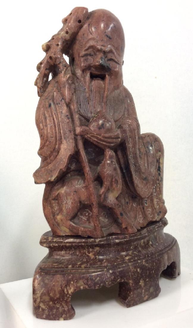 Vintage/Antique Chinese Soupstone Elder Man: Vintage/Antique Chinese Soapstone Elder Man in Robes Carved Statuette. Brown toned soapstone with black and beige toned natural coloration, smiling elder man in robes with small deer like creature. Se