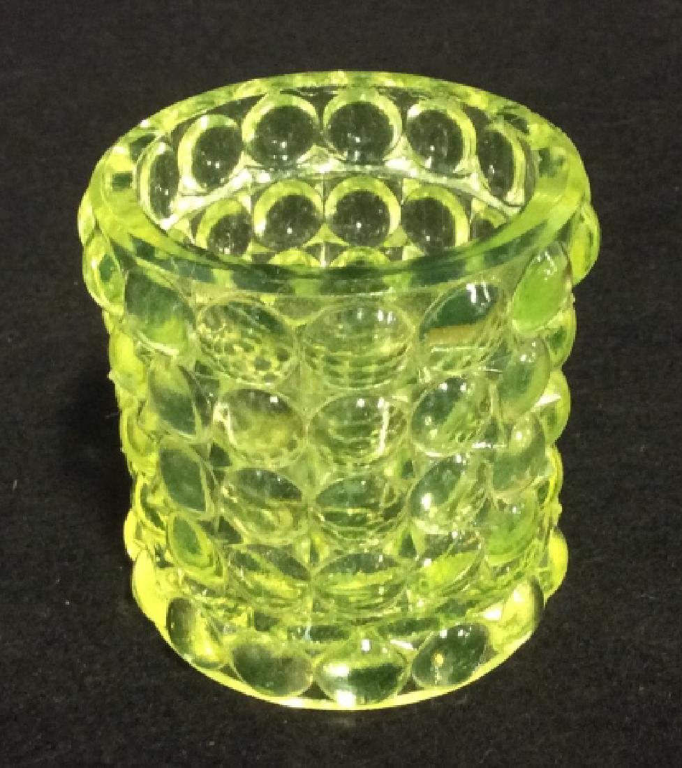 Translucent Yellow Neon Toned Vessel: Glass cup vessel, is yellow toned and textured with raised bumps. Vaseline galss, bubble glass, collectible, upcycle vase, trinket dish,yellow green toned. Translucent. Measures approx. 2.5 by 2.5