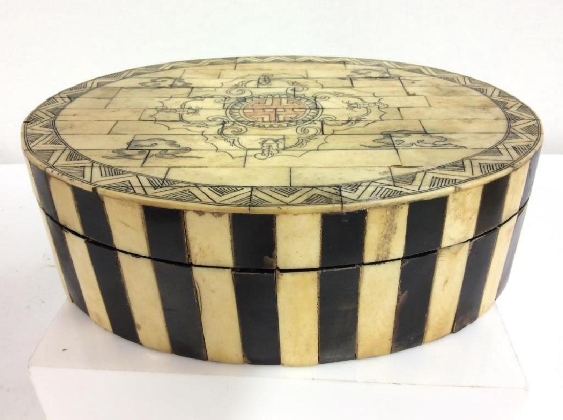 Bone Inlaid Tile Keepsake Box: Bone Inlaid Tile Keepsake Box. Black and beige toned bone tiles inlay design, with etched lid design featuring geometric line design trim, mythical animal motifs, and cloud motif designs. Some discolo
