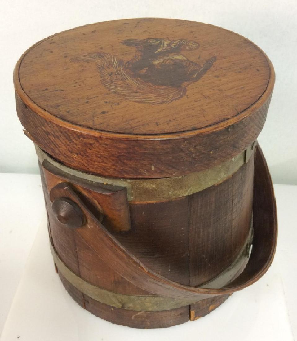 Ferkin Bucket Tobacco Jar w Squirrel: Ferkin Bucket Tobacco Jar w Squirrel Design on Lid. Wooden bucket, tobacco jar, wooden panels with brass toned metal bands. Some surface wear to wood, chips in finish chipped edges, some loose pieces.
