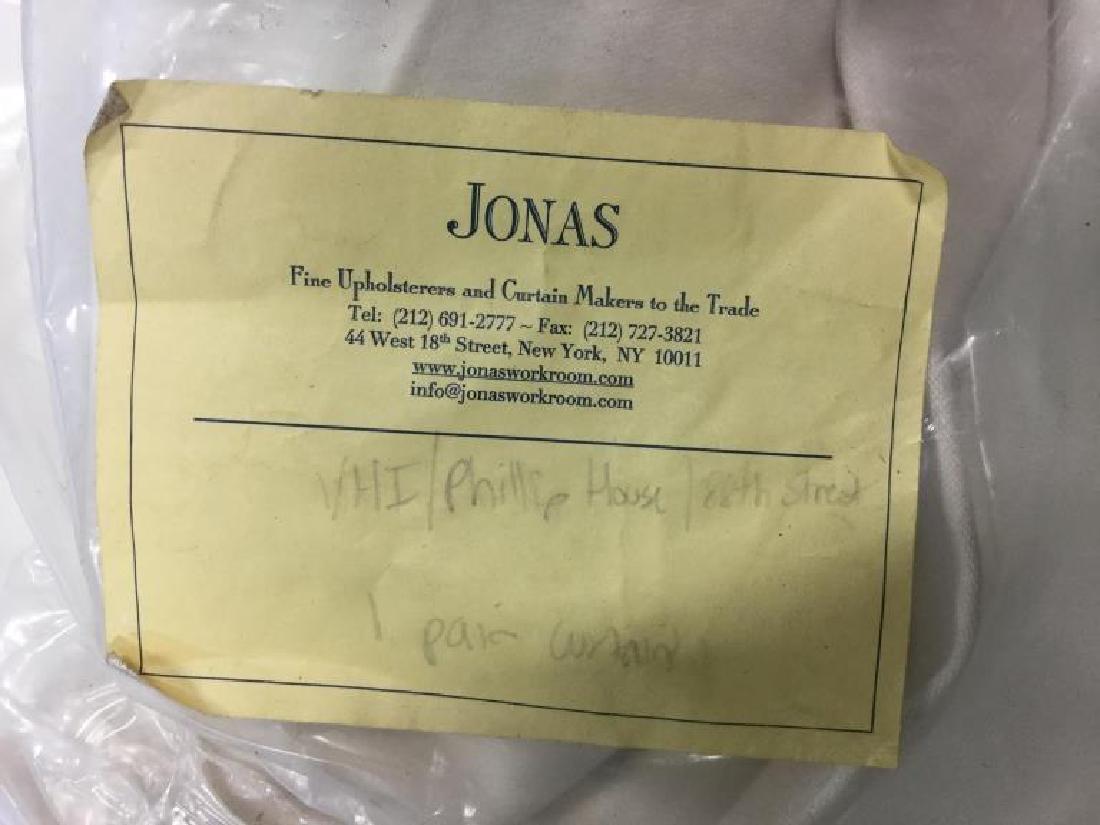 Group Lot JONAS Window Treatments: Group lot of 4 bags of window treatments. Bags contain approx.3pairs of curtains. 2 pairs are grey and white toned with grey boarder. 1 pair is pink/white toned, with pink toned boarder. Contemporary