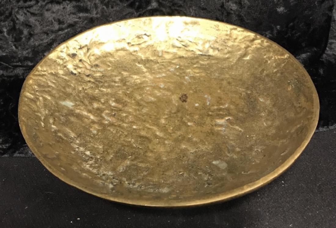 Bronze Stamped Germany Trinket Dish: Short Pedestal Marked Circular Bronze stamped Dish. Made in Germany. Gold toned dish, table accessories, textured plate. Measures 9 inches wide by 2 inches tall. German arts and crafts, tableware, dec