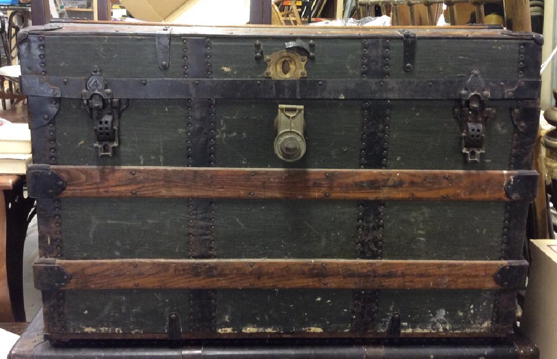 Vintage Hemp Canvas Wooden Chest With Wheels: Vaudeville Chest belonging to consignors father, traveled the country for vaudeville acts, Vintage green toned hemp canvas wooden chest with wheels is designed with black metal latches and wooden guar