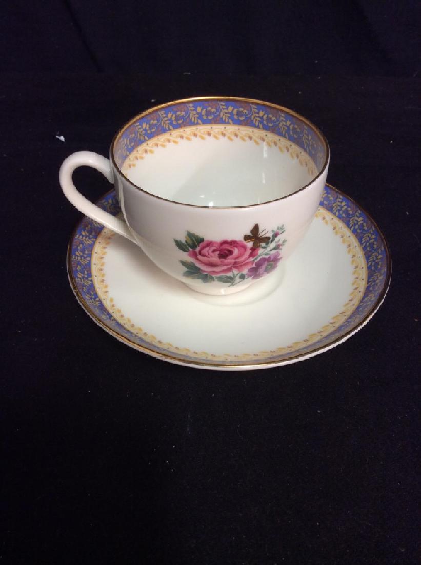 Set 6 HANAE MORI DINNERWARE Japanese Plates: Set of six includes two teacup, two teacup plates and two plates with floral detail. Plates contain gold toned trim, blue rims with yellow floral detail, and a ring of yellow swirled leaves. Minor sta