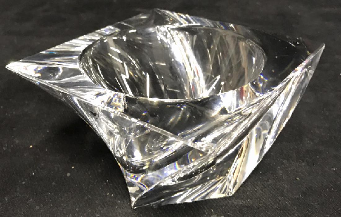 ORREFORS Sweden Glass Square Bowl: ORREFORS Sweden square glass bowl is designed with a circular opening. Bowl contains a curved shaped body. No visible damage. Measures approx 3.5 inches tall x 5.5 inches wide. Swiss design, designer 