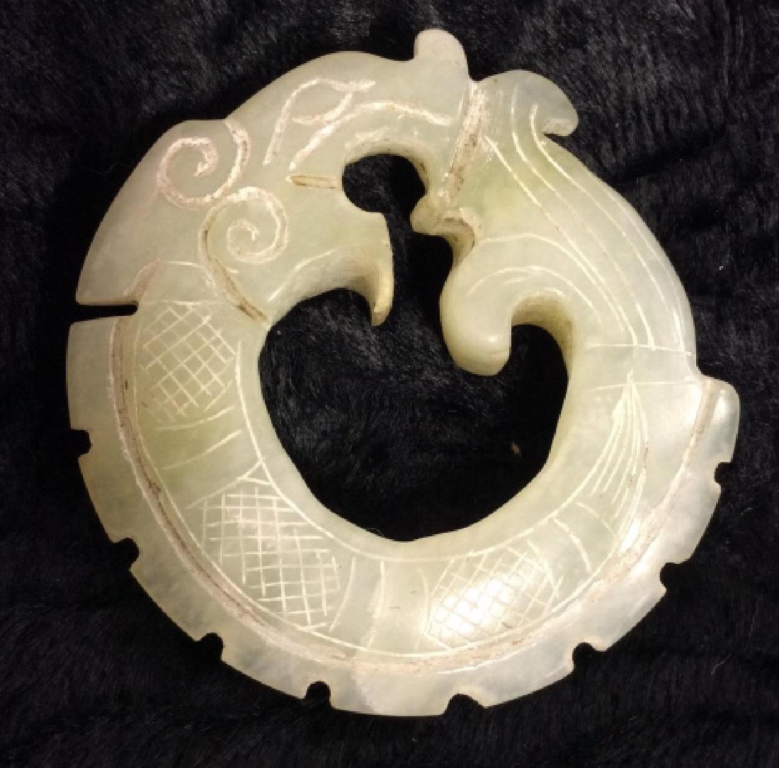 Vintage Jade/Jadeite Ouroboros Pendant Totem: Vintage Jade/Jadeite Ouroboros Pendant Totem. Carved jade or jadeite natural stone in he form of Ouroboros, a serpent biting it's tail. Measures approx 3 in in diameter.