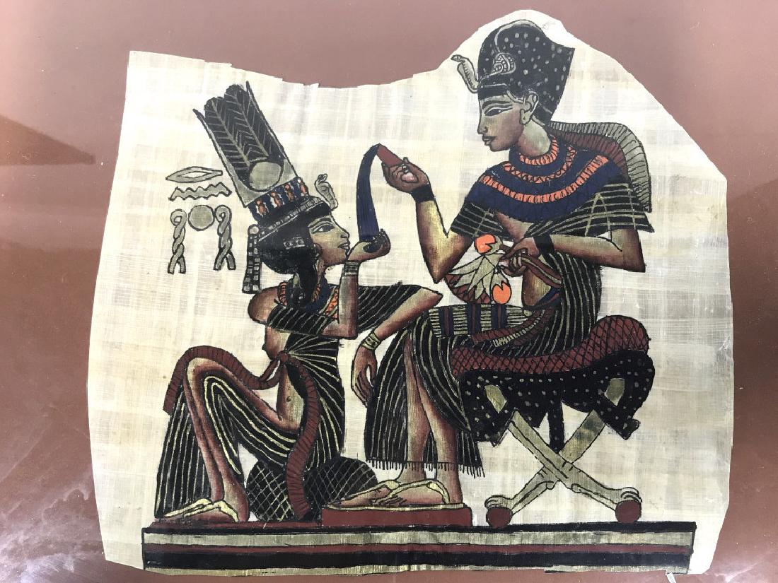 Lot 2 Egyptian Style Paintings On Paper: Paintings appear to be on handmade paper. One depicts 2 human figures the other depicts a figure riding in a chariot pulled by horse & shooting arrows. Measures approx 20 inches long 16 inches tall. P