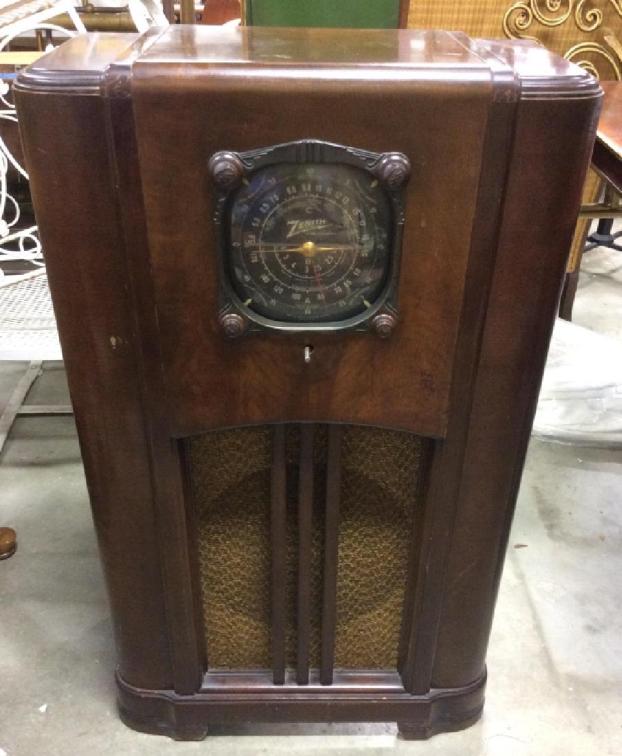 Poss Vintage Floor Sized ZENITH Radio: Radio appears to be vintage. Front of radio reads ZENITH. Appears to have 4 knobs. Radio is wooden. , Carved Mahogany Casing, Contains some wear. Measures approx 41 inches tall 21 inches long 12 inche