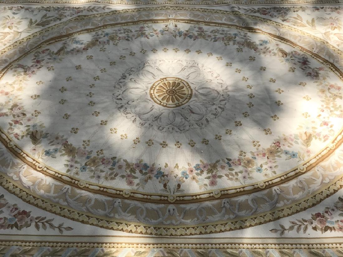 Antique French Handmade AUBUSSON Rug: Rug is handmade. Appears to be wool. Contains intricate multi toned floral detail including tones of pink, light blue, green, beige and cream. Has medallion detail in center. In very good condition. M