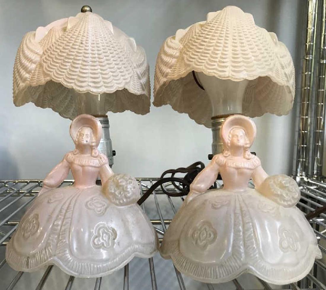 Pair Pink Opaline Glass Figural Lamps: Each measures ht app 10 inches, good vintage condition, vintage lamps, one has minor surface wear on face, Property of Bedford New York Estate, and multi-generational antiques and Collectibles Shop Ow
