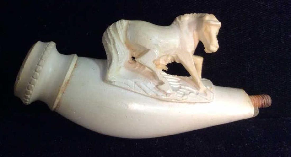Vintage/Antique Carved Bone Style Pipe: Vintage/Antique Carved Bone Style Pipe. Section of smoking pipe, appears to be carved bone or Meershaum. Decorated with dimensional carving of a horse. Some minor surface wear. Comes with vintage leat