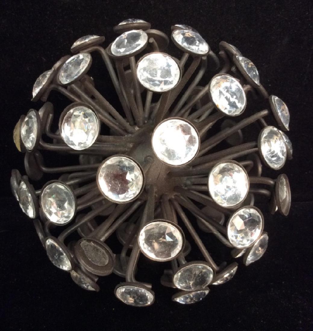 Rhinestone and Metal Sphere Sculpture: Rhinestone and Metal Sphere Sculpture. Black toned metal, radiating spikes tipped with round rhinestones. Some missing rhinestones. Measures approx 6 in in diameter. Home decor, home accessories, tabl
