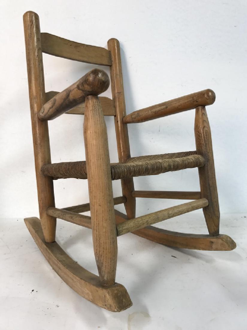 Vintage Rush Seat Children's Rocking Chair: Vintage Rush Seat Children's Rocking Chair. Contains wear consistent with age. Measures approx 23 inches tall 14 inches, 19 inches deep. Vintage furniture, child's furniture, dolls furniture.