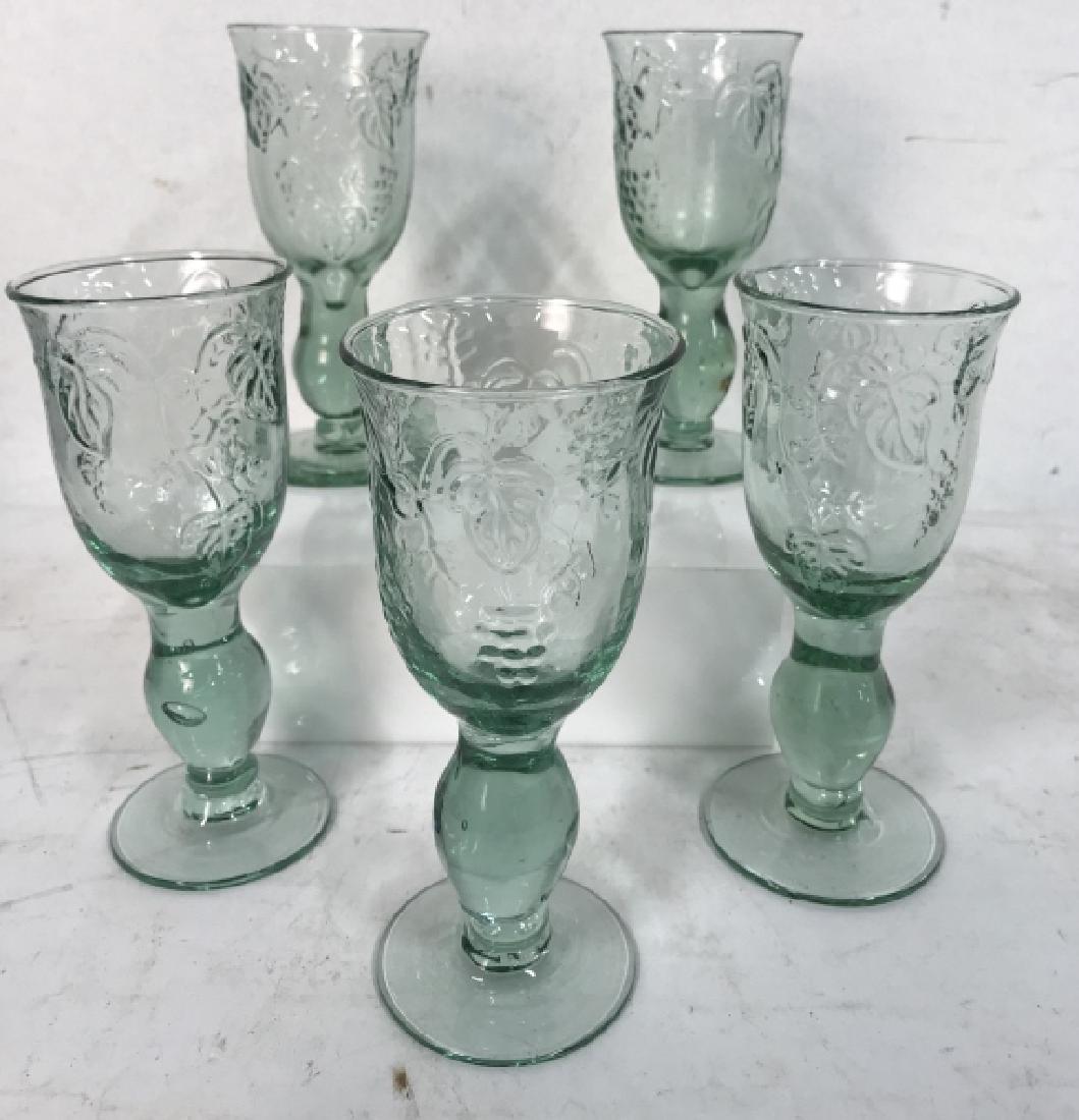 Set Of 5 Green Glass Goblets: Set Of 5 Green Glass Goblets With grape and vine raised design. Drinking glasses. Wine Goblets. No condition issues noted. Measures approx 6.5 inches tall. tableware, tabletop, drinking glasses, goble