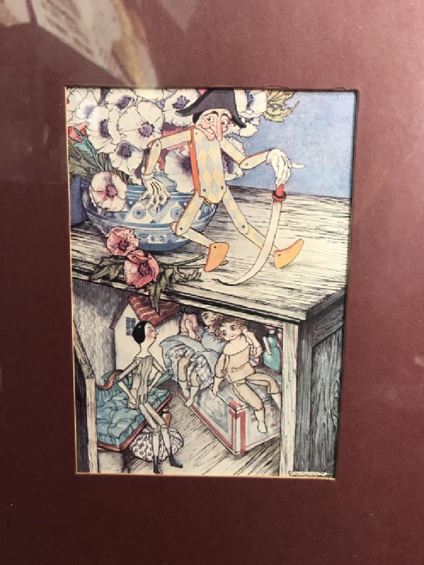 Framed Print Of Puppets And Dolls: Framed Print Of Puppets. Framed and matted poster print depicting puppets and dolls playing. Framed in a red and gold toned frame and dark red mat. No condition issues noted. Measures approx 14 inches