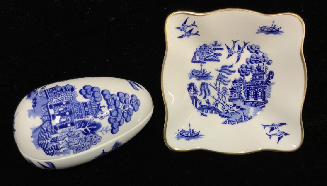 Lot 2 Coalport Willow English Trinket Dishes: Lot 2 Coalport Willow English Trinket Dishes. Two Coalport Bone China trinket dishes in the classic Willow blue and white pattern. One pill box dish is lidded and in the shape of an egg, second is squ