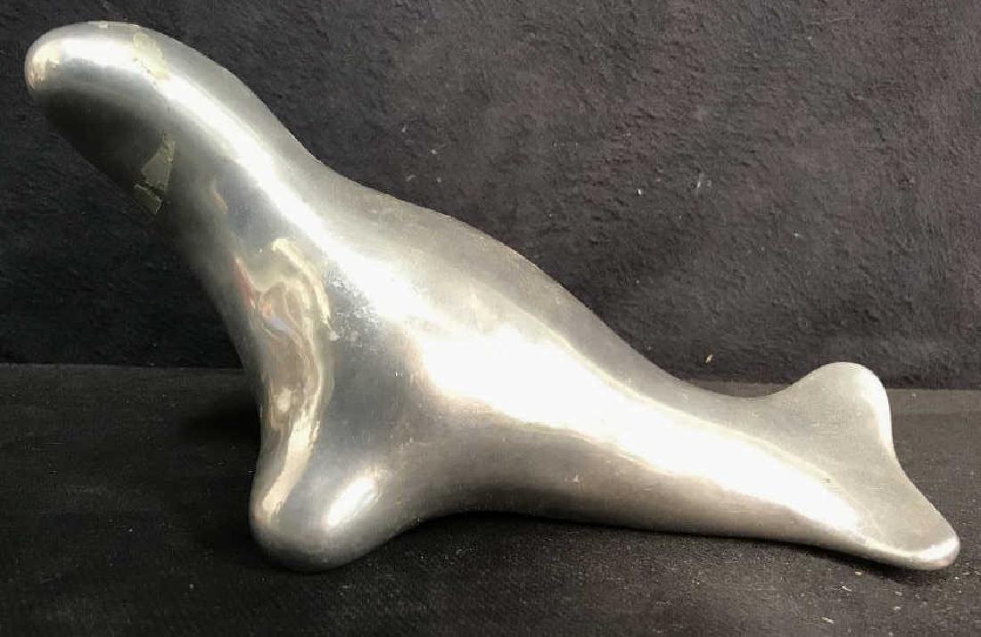 Metal Seal Signed HOSELTON CANADA: Metal Seal Signed HOSELTON CANADA 399 on underside. Measures 10 inches long 5.5 inches tall. Has some wear and stuck on tape. Animal figural, statuette, home decor, home accessory, tabletop decor.