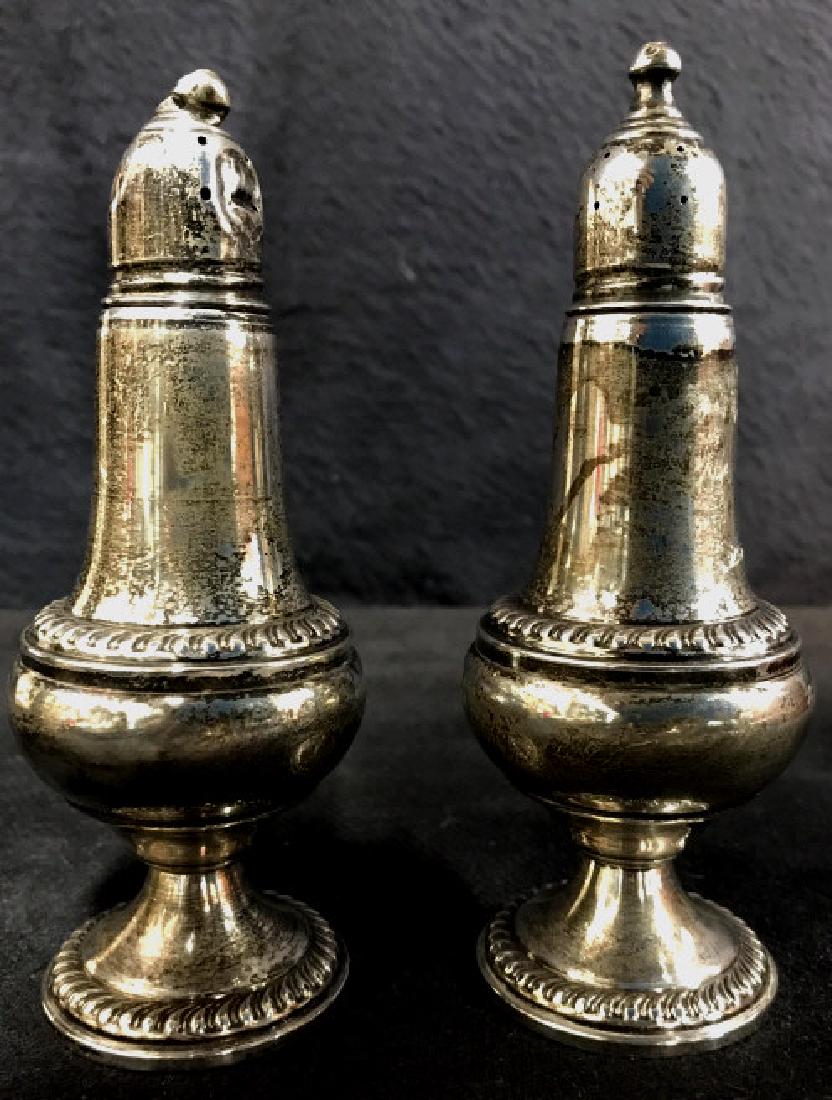 2 EMPIRE Sterling Weighted Salt & Pepper Shaker: Lot includes 1 salt shaker and 1 pepper shaker. Underside of each reads EMPIRE STERLING WEIGHTED. Each measures approx 5 inches tall 2 inches wide. Tableware, tabletop accessory.