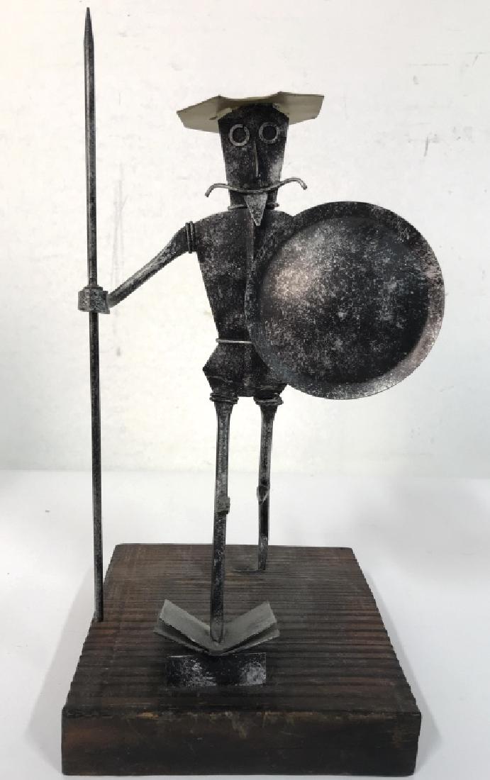 Metal Warrior Figural W Wooden Base: Figural has spear, shield and helmet. Figural is metal, base is wooden. Measures approx 12 inches tall 6 inches wide and deep at base. Art sculpture, Don Quixote, statuette, home decor.
