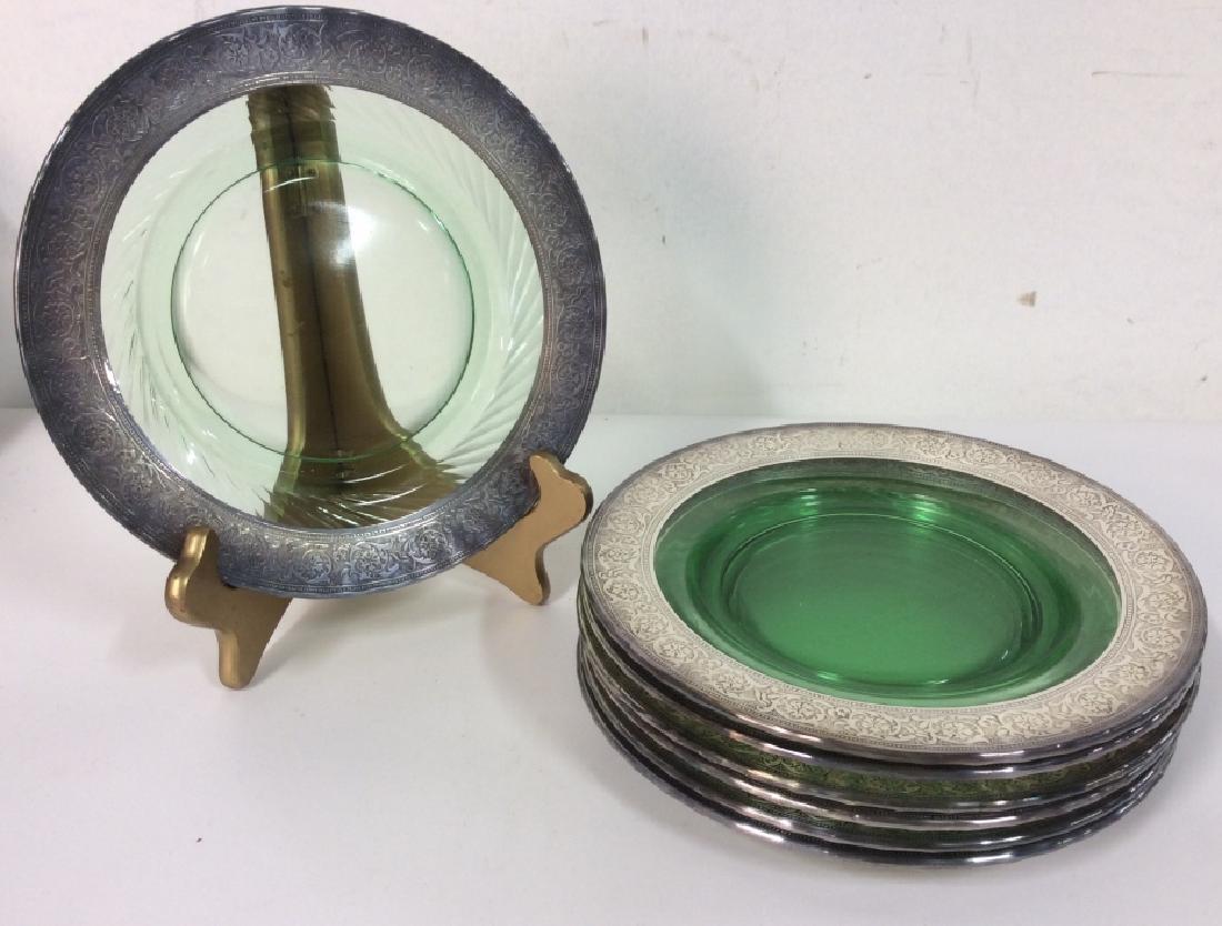 Set 7 Sterling Trim Glass Plates: Set 7 Sterling Trim Glass Plates. Green toned glass plates with sterling silver rim design. Some minor surface wear and discoloring. Plates measure approx 8 1/2 in in diameter. Tableware, dinnerware, 
