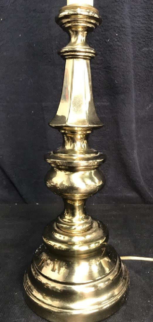 Gold Toned Poss Brass Lamp: Lamp is gold toned and metal. Includes gold toned finial. Finial is worn. Measures approx 28 inches tall 6 inches wide. Does not include shade. Table lamp, vintage lighting, home decor.