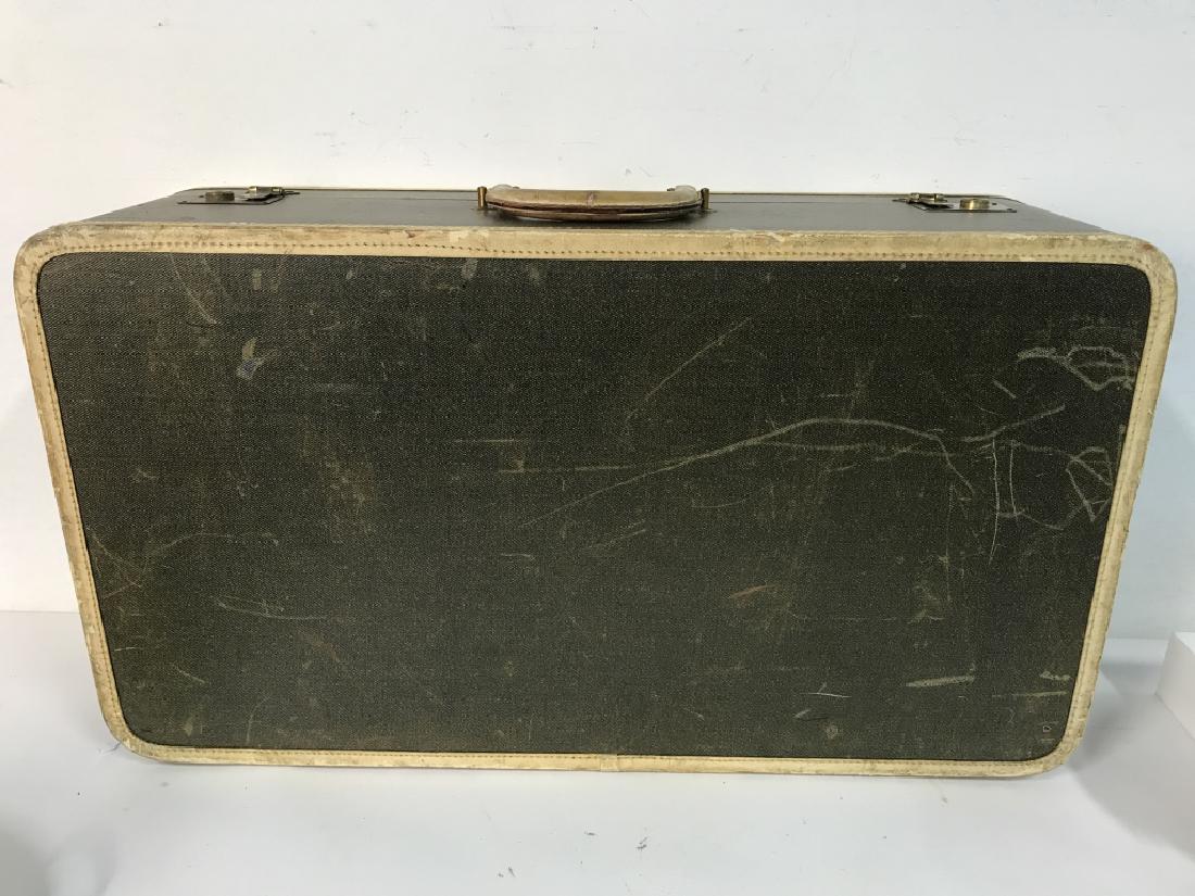 LEXINGTON BLOOMINGDALES Vintage Suitcase: Suitcase Is green toned with cream toned accents and handle. Does not include key. Suitcase is locked. Measures approx 29 inches long 9 inches deep 16 inches tall. Contains scratches and wear.
