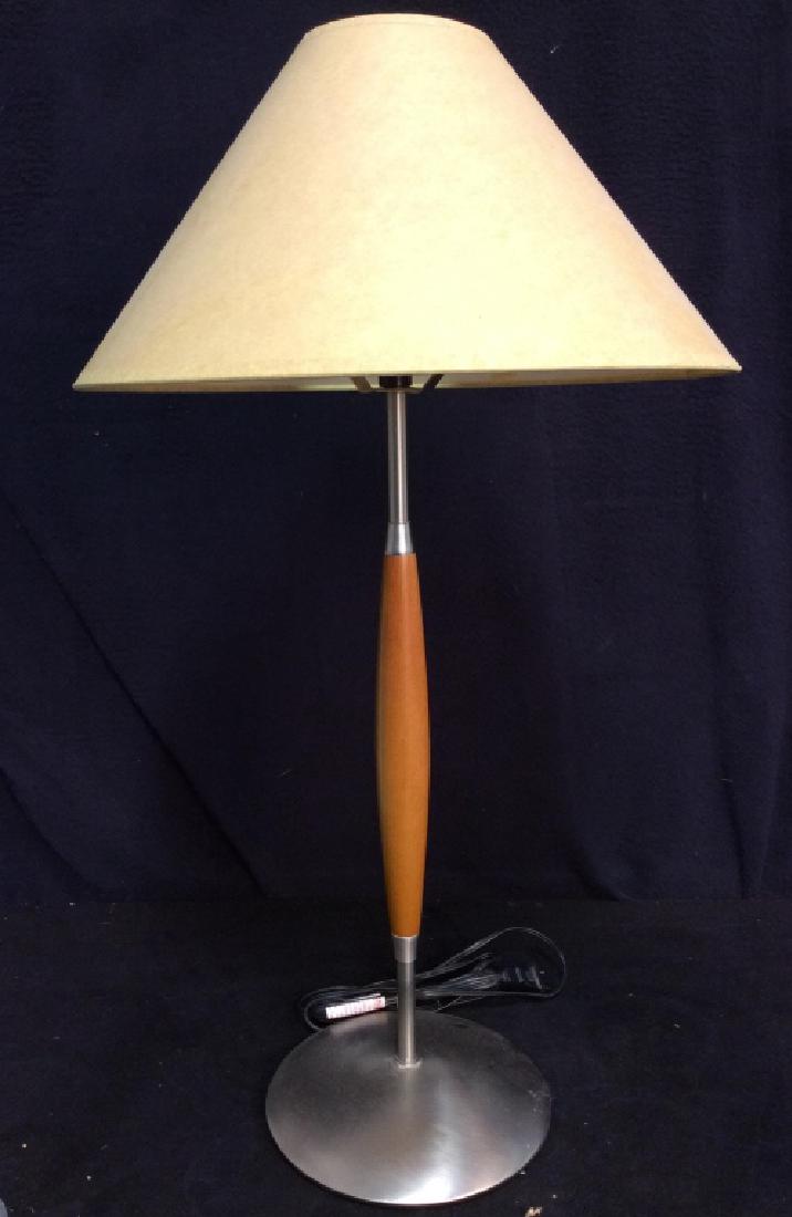 Slim Body Wooden & Metal Lamp W Shade: Lamp is wooden and metal. Base is metal and circular. Shade has light beige tone. measures approx 26 inches tall 7 inches wide without shade.