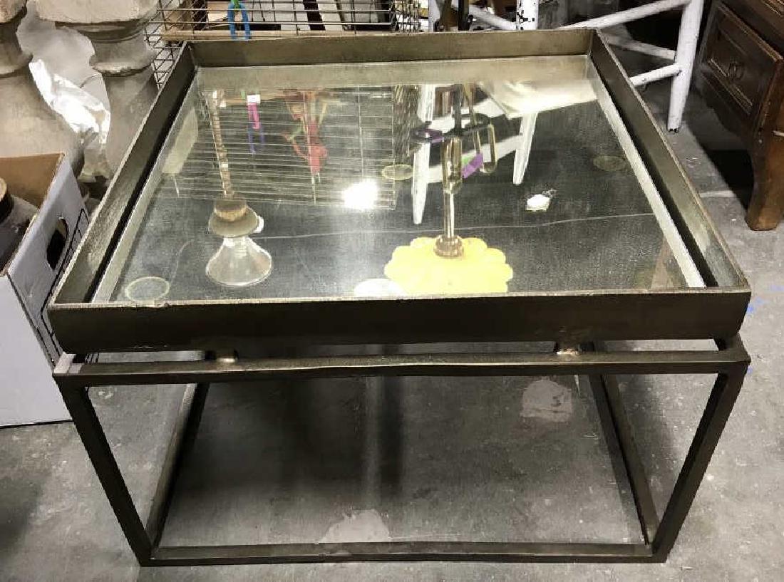 Mirror Top Metal Coffee Table: Mirror Top Metal Coffee Table. Measures approx 23 inches 17 inches tall. Has some wear and spots on glass