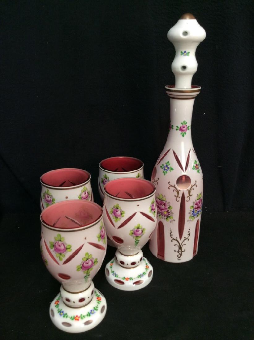 Set5 Bohemian Glass Decanter W Goblets: Set5 Bohemian Glass Decanter W Goblets. White and pink toned opaline art glass with cut out revealed pink cranberry toned glass. With painted floral design. Measures approx 17 in tall by 4 in wide. CO