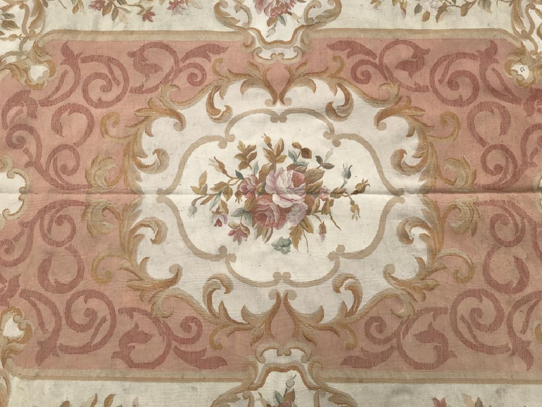 Handmade Vintage Floral Detailed Aubusson Rug: Rug is Handmade. Rug is vintage possibly antique. Contains tones of pink, cream, beige, orange, and green. Contains floral leaf and vine detail. Measures approx 105 inches long 71 inches wide. Area ru
