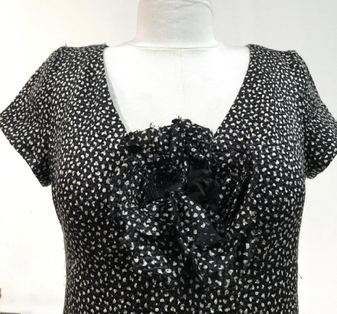 ARMANI Woman’s Cocktail Dress: ARMANI Woman’s Cocktail Dress. Black and white toned fabric with fabric ruffle flower design, 60# wool, 40% silk, ARMANI COLLEZIONI size 8. Measures approx 38 in long. Some minor surface wear. Vinta