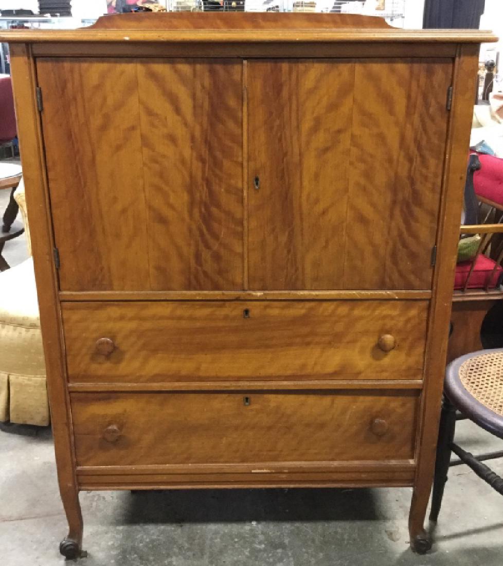 Vintage Wooden Standing Footed Cabinet: Vintage Wooden Standing Footed Cabinet With hinged doors and two drawers. Each section has a lock, key included, top section has damage lock, does not unlock or open. Has surface wear and some damage.