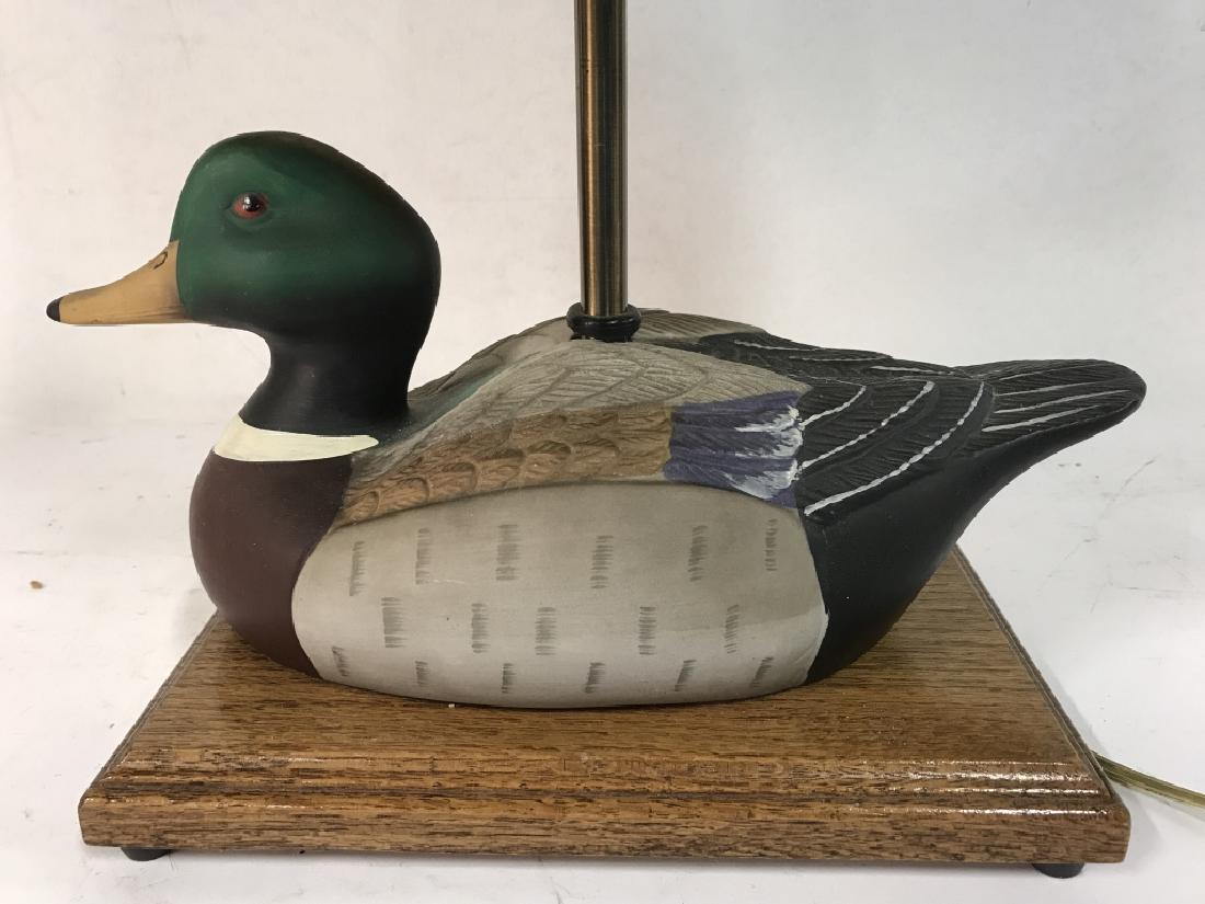 Duck Lamp W Shade: Lamp has duck Figural. Has black toned Shade. Base is wooden. Measures approx 18 inches tall 11 inches wide7 inches deep. Vintage lighting, animal figure, duck sculpture.