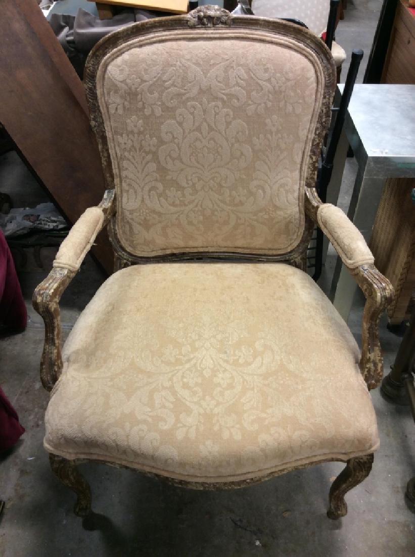 Upholstered Carved Wooden Chair, Bergere: Country French Style, upholstered arms, Bergere Chair, Upholstered Carved Wooden Chair. Beige toned upholstery with floral filigree pattern. Carved wooden body, some significant weathering to wooden f