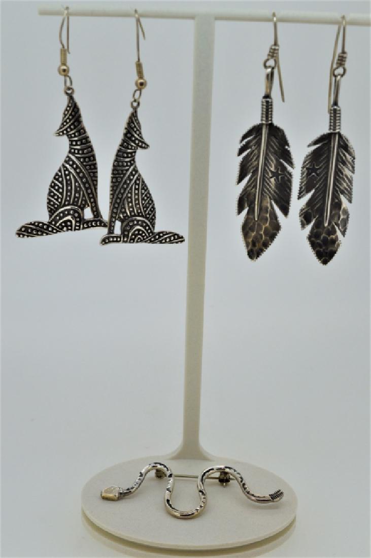 Lot of Ladies Sterling Southwestern Jewelry: Lot includes 2 1/2" l hammered feather earrings, 2 1/4" l coyote earrings & 2 1/4" l rattlesnake pin, 14.7 dwt of .925 silver