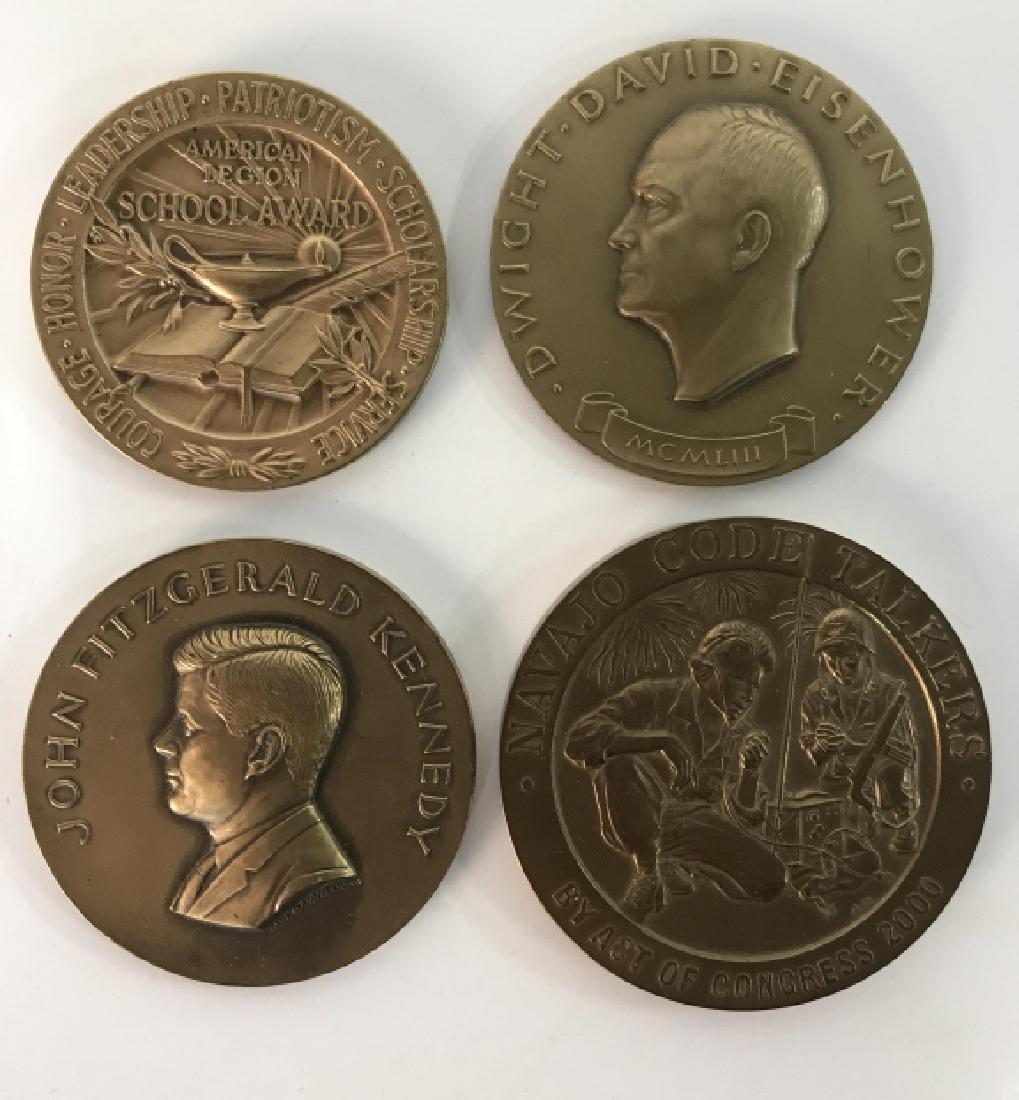 Lot 4 Bronze Patriotic Medals: Lot includes 4 medals which appears to be bronze. One depicts John Fitzgerald Kennedy, one depicts Dwight David Eisenhower, one reads Navajo Code Talkers, One reads American Legion School Award. Appea