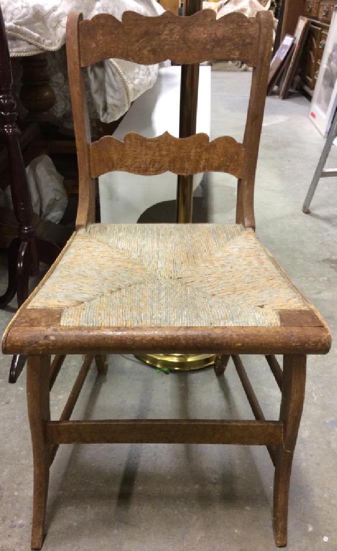 Vintage Carved Wooden Chair W Rush Seat: Chair has carved wooden detail. Chair is vintage, possibly antique. Contains wear consistent with age. Measures approx 31 inches tall 18 inches wide and deep. Side chair, dinner chair, vintage furnitu