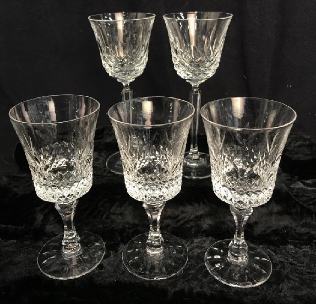 Lot 5 LENOX and CLARIDGE Crystal Glass Stemware: Lot 5 LENOX and CLARIDGE Crystal Stemware. Three LENOX glass goblets and two CLARIDGE full lead crystal wine glasses. Decorated with geometric designs, one minor rim chip on one CLARIDGE piece. Talles