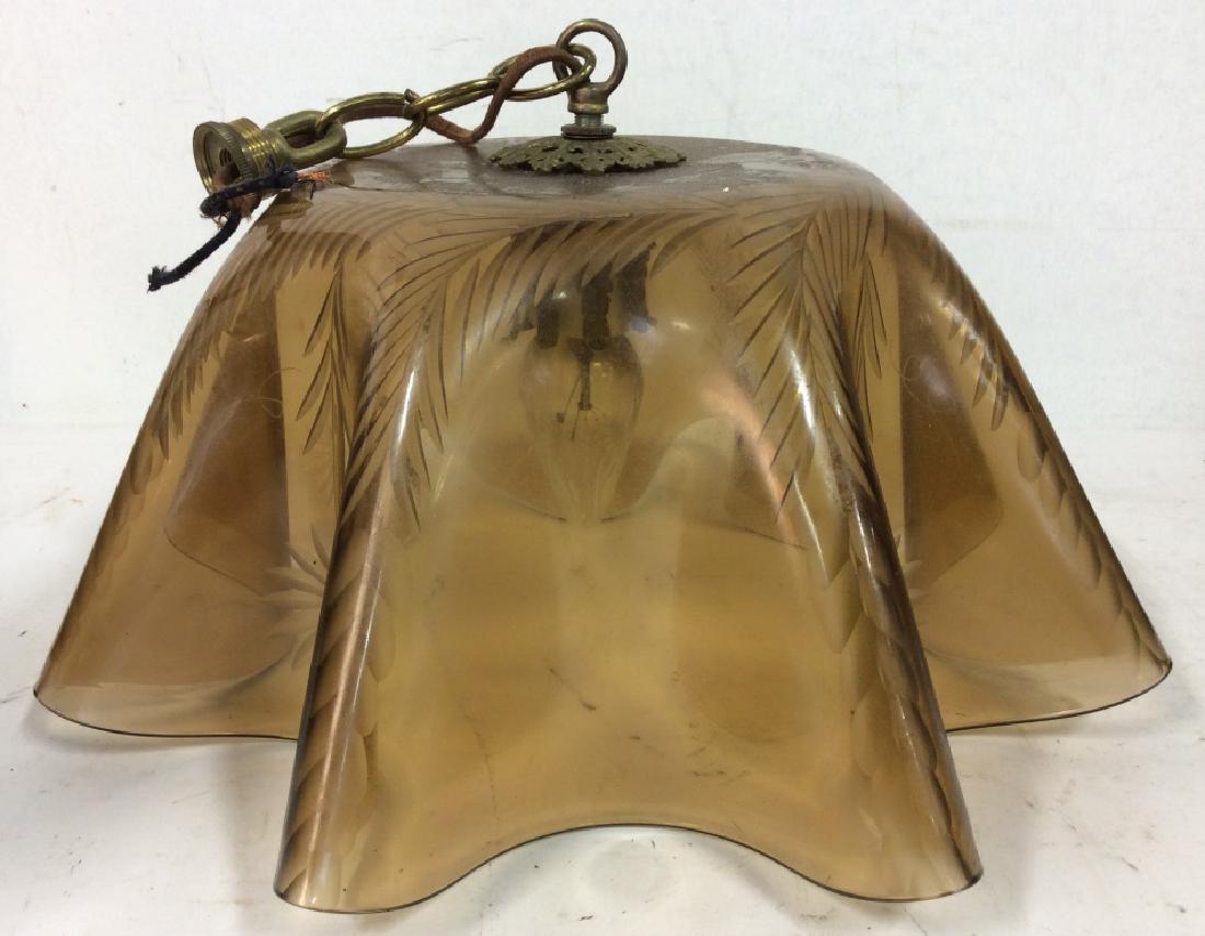 Glass Frilled Ceiling Lamp: Ceiling lamp, ceiling light, home lighting, home decor. Lamp has frilled structure. Has a beige tone. Has frosted floral & leaf detail on inside. Measures approx 14 inches wide, 13 inches tall when ha
