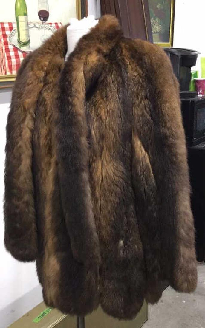 GEORGEOU FURS Medium Sized Fur Coat: GEORGEOU FURS size medium fur coat. Includes attached scarf. Possibly mink. Fully lined silk, measures 17 inches wide, 24 inches long sleeve, 31 inches long coat.