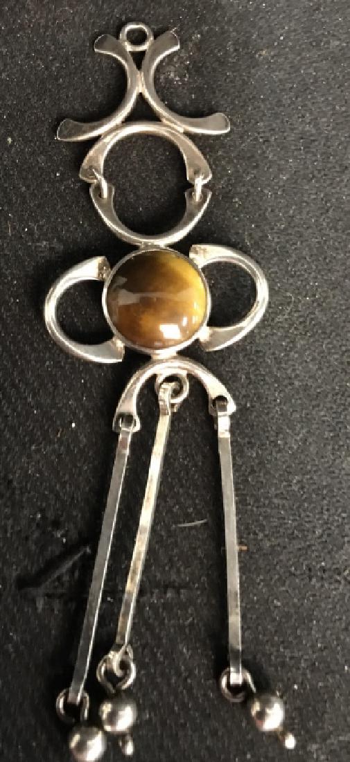 Israeli Modern Sterling Tigers Eye Pendent: Circa 1960-1970 sterling silver dangling figural ole work with Set Tigers Eye Stone, marked for Israel marked for Sterling, jewelry, estate jewelry, has makers mark illegible, Israel arts and crafts, 
