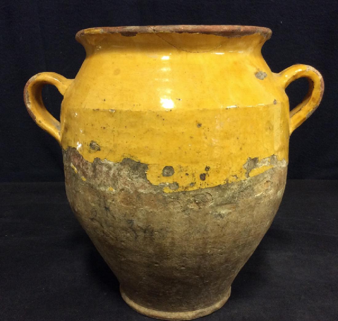 French Pottery Glazed Gargoulette Jug: French Pottery Gargoulette Jug with applied Mustard glaze, two handles, cracks and chips to the glaze, overall measurements approx 11 x 13 in at widest point and approx 7 1/2 inches diameter at openin