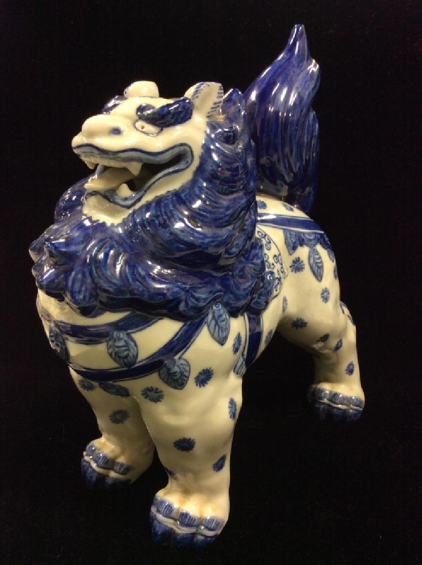 Chinese Porcelain Foo Dog: Chinese Porcelain Foo Dog. Vintage Asian sculpture, porcelain Figural, asian arts and crafts, Foo dog, temple lion, mythic sculpture. White toned porcelain with blue toned design, standing temple lion