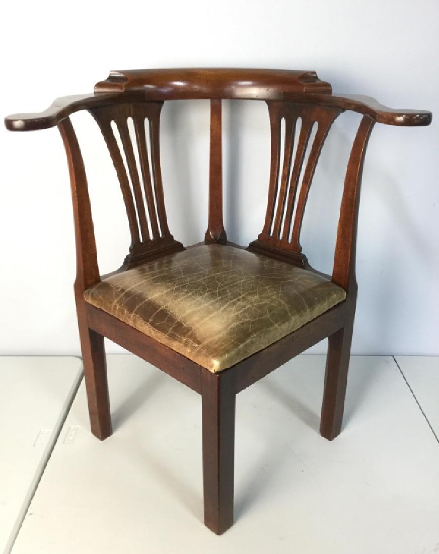 Mahogany and Leather Corner Gentleman’s Chair: Mahogany Round About Chair with leather upholstered seat, good condition, Originally purchased through Marc Michaels Interior Design Inc, independently appraised 5/1/00 for $2812., good condition, mea