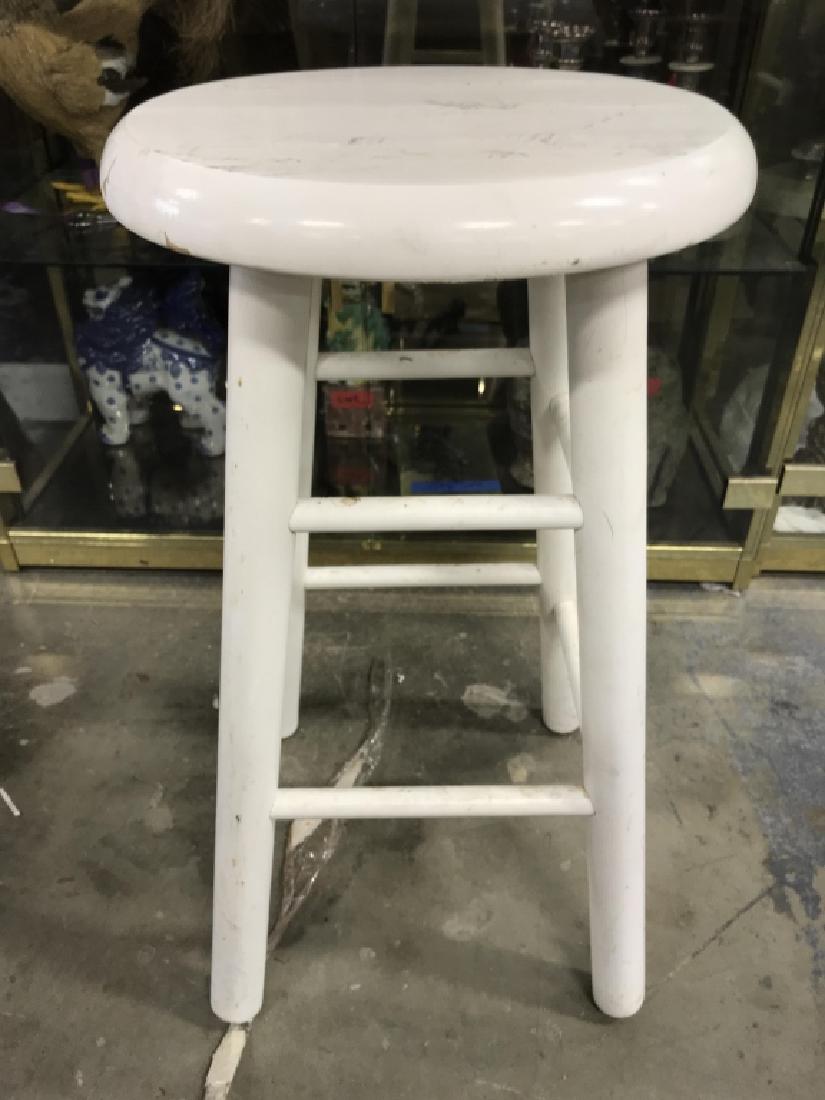 Poss Vintage White Toned Wooden Stool: Stool is wooden and white toned. Contains 4 legs. Piece has evident scratches and wear. Measures approx 24 inches tall, 12.5 inches deep & wide. 6