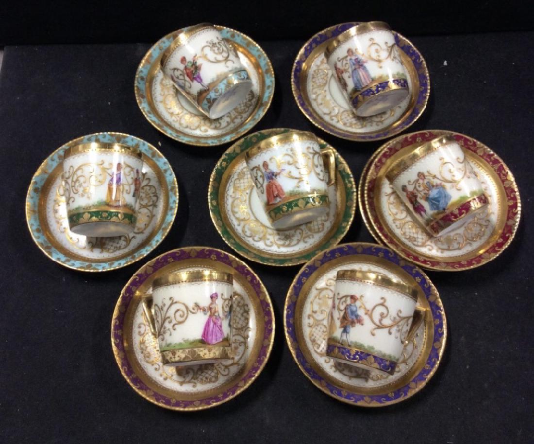 Antique DRESDEN Porcelain Tea Set: Each piece and painted Victorian scenesand figurals with paste up detailing, Set includes different colored intricately detailed 8 under plates diameter 4 inches, each cup hand painted, Gilded, ornate